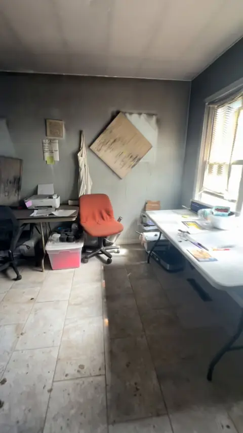 Dining room with smoke-stained walls